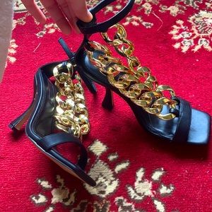 Never worn before black gold heel